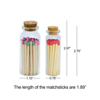 Two glass jars with cork lids containing colorful and plain matches, with measurements displayed.