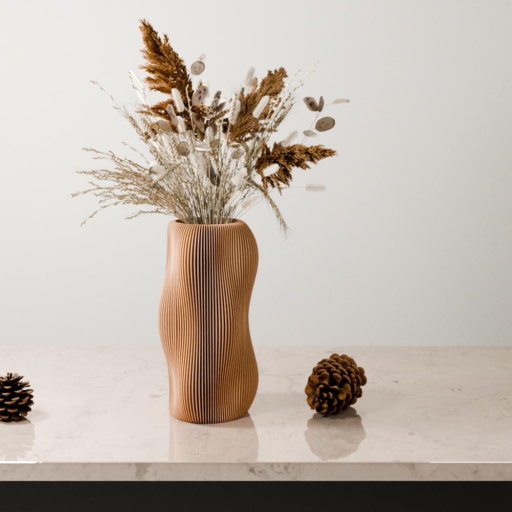 Wooden vase with dried plants on a marble surface