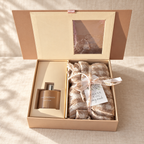 Reed diffuser gift set with scarf: open beige gift box with home fragrance diffuser and beige scarf tied with a Thank You tag