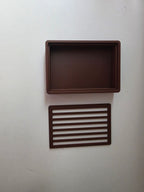 A dark brown rectangular tray with a textured interior and a matching rectangular slatted insert, displayed on a plain off-white background.