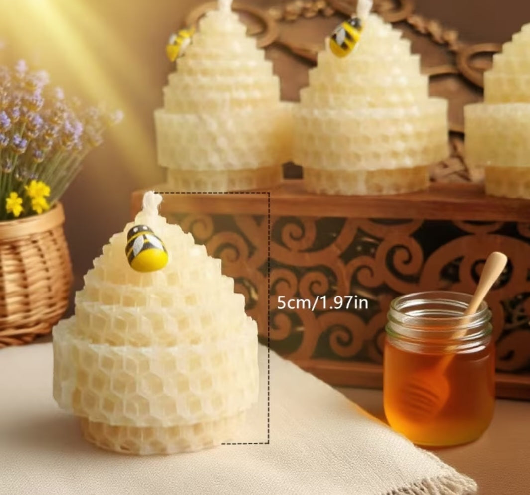 A honeycomb-style beehive candle in the foreground with a small bee decoration on top, shown beside a jar of honey and a text overlay reading 5cm/1.97in.