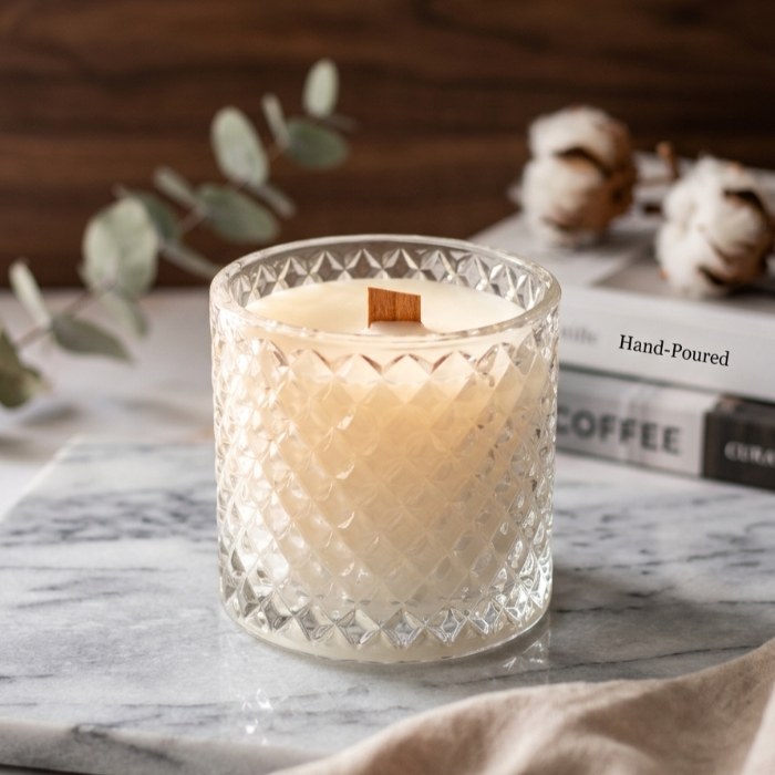 Handcrafted soy blend candle in textured diamond-cut crystal glass jar with natural wooden wick