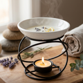 Black metal ceramic wax melt warmer with white dish, tealight candle and lavender decor