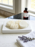 A white massage soap in the dish
