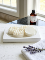 A white massage soap in the dish
