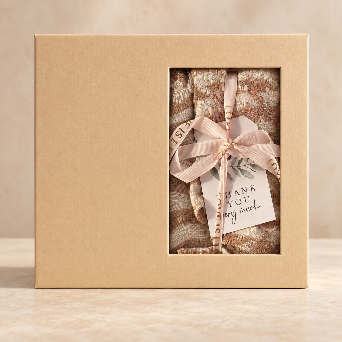 Reed diffuser gift set with scarf: closed kraft gift box with window showing the scarf and Thank You tag