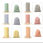 Turkish peshtemal beach towels with matching striped drawstring bags on white background: green, gray, blue, red, yellow and orange