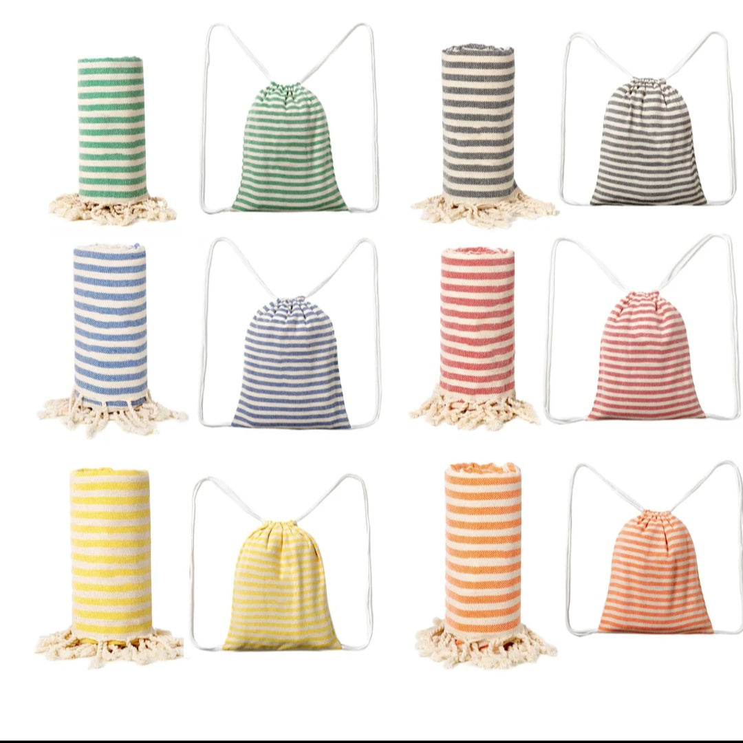 Turkish peshtemal beach towels with matching striped drawstring bags on white background: green, gray, blue, red, yellow and orange