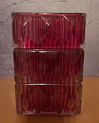 Close-up detail of magenta square glass vase showing geometric diamond-cut ice-crackle texture