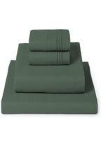 A set of folded bedding, including a flat sheet and two folded pillowcases, in a solid dark sage green color, arranged in a stepped stack on a white background.