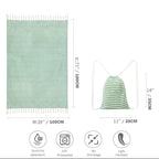 Green Turkish peshtemal towel size guide: 39 by 71 inch towel with tassels and 11 by 14 inch drawstring bag, quick dry, prewashed, no shrinkage, light and compact