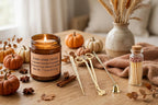 Candle Ritual gift set: lit Toasted Vanilla Pumpkin soy candle with gold wick trimmer kit and matches among fall pumpkins