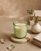 SOMA HOME Small 6 oz Desert Bloom Scented Jar Candle with natural soy wax in a textured green glass jar, styled on a wooden coaster.