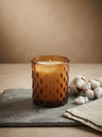SOMA HOME Small 6 oz Fresh Cotton Scented Candle in a textured amber glass jar with a diamond pattern, styled on a gray slate tray next to cotton bolls.
